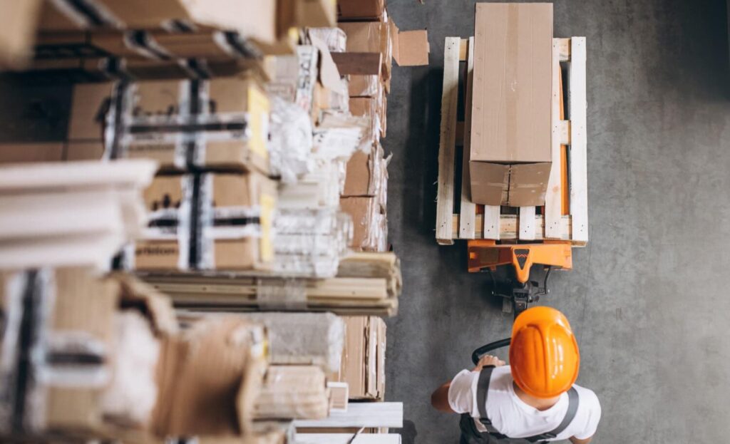 man moving pallets